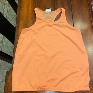 Nike girls coral tank top. worn one to two times. I love this top! was to small.